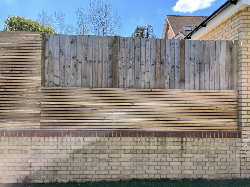 Slatted screening: Horizontal slats fixed over the old fence and garden wall.