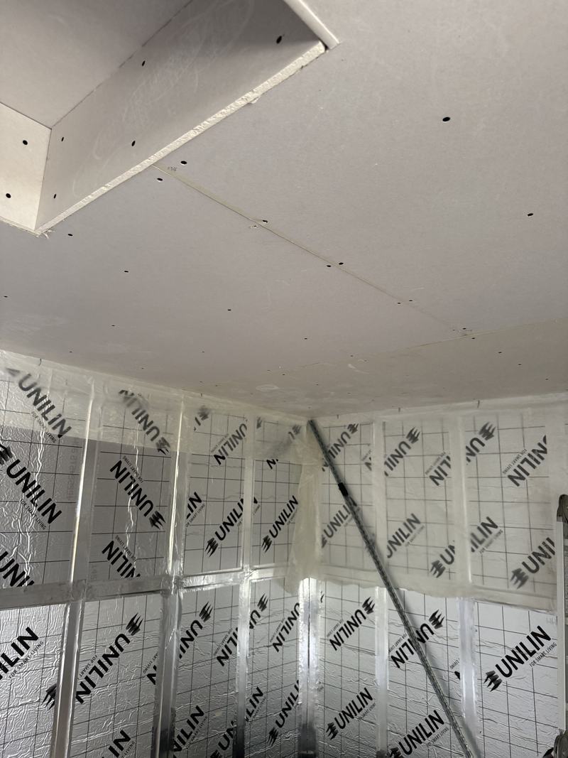 Insulation: Insulation boards fitted and taped around the frame.