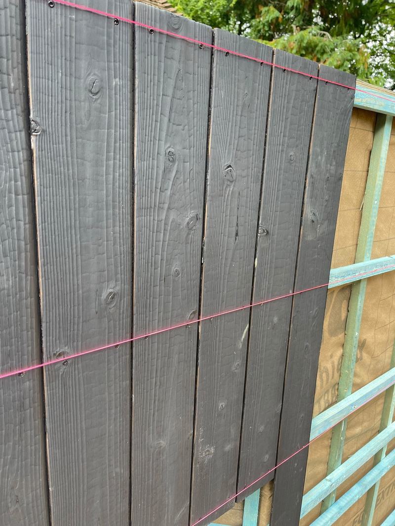 Cladding detail: Sho sugi ban boards set out and fixed to a string line.
