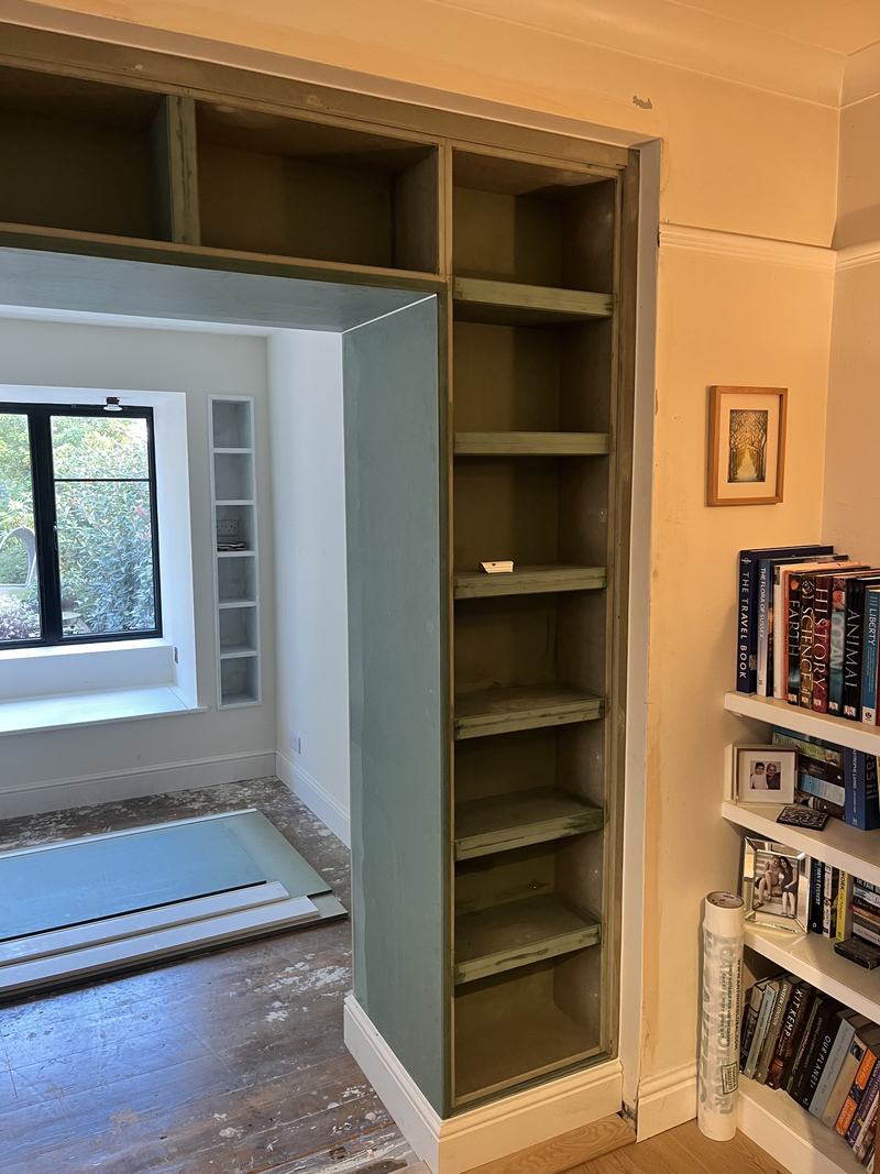 Book storage: Shelving built around the new opening.