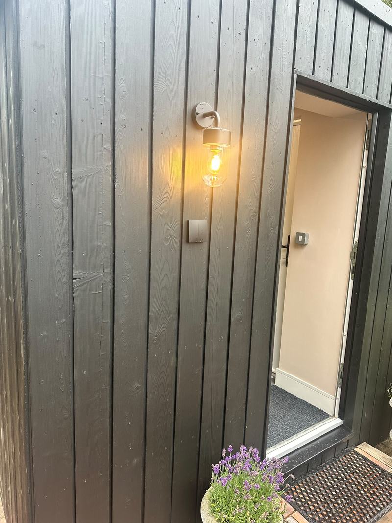 Close-up of sho sugi ban charred timber cladding on a garden studio