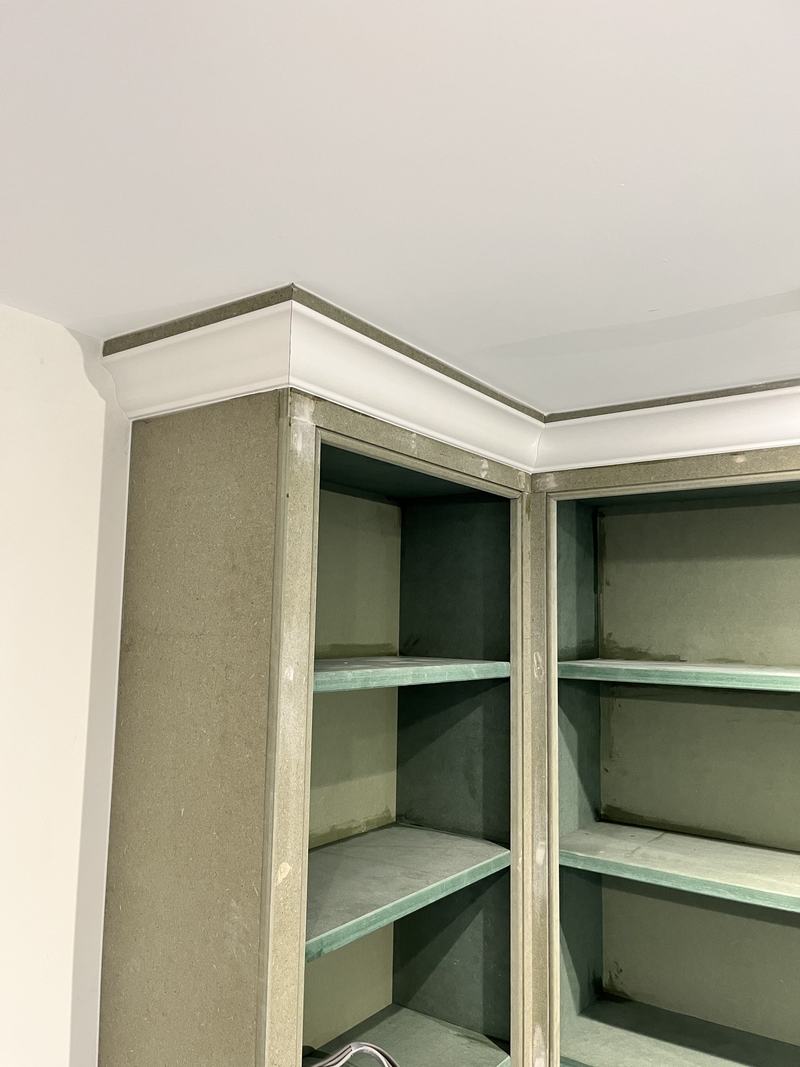 Cornice: A cornice fitted to finish the top of the shelving.
